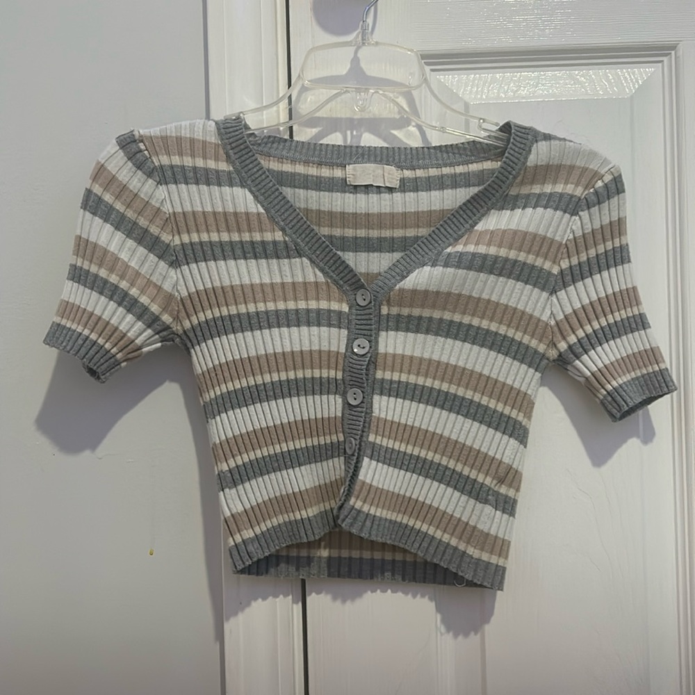 Cropped button up tee shirt, can be worn by teens or woman.